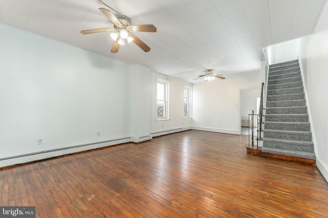 unfurnished living room featuring ceiling fan and dark hardwood / wood-style floors