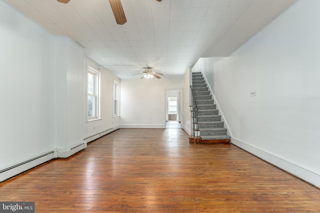 unfurnished living room featuring ceiling fan and wood-type flooring