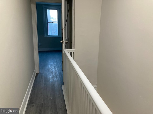 corridor featuring dark wood-type flooring