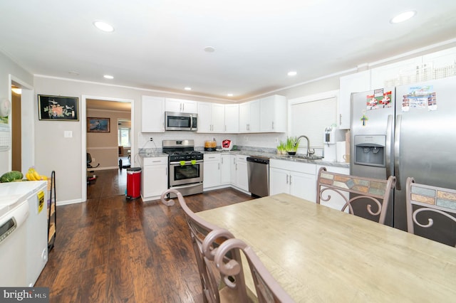 kitchen featuring white cabinetry, sink, stainless steel appliances, tasteful backsplash, and light stone counters