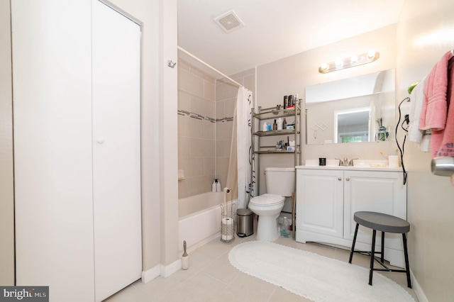 full bathroom featuring shower / tub combo, vanity, toilet, and tile patterned floors