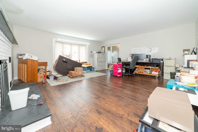 living room with a fireplace and dark hardwood / wood-style floors