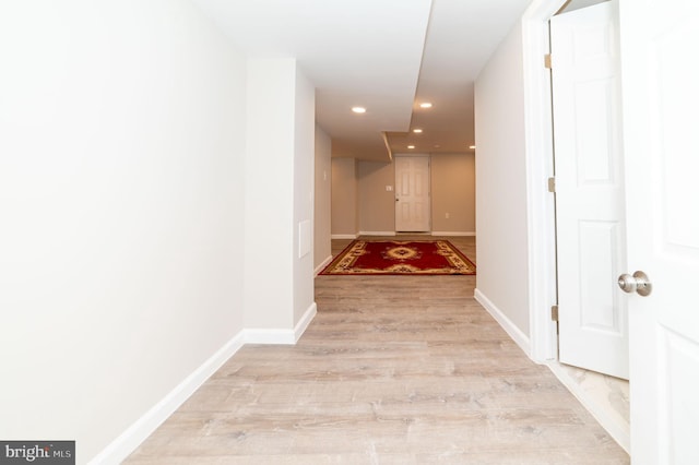 hall with light wood-type flooring