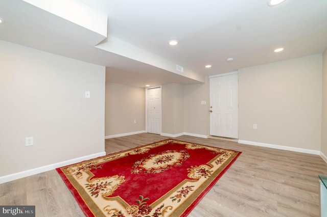 basement featuring hardwood / wood-style flooring