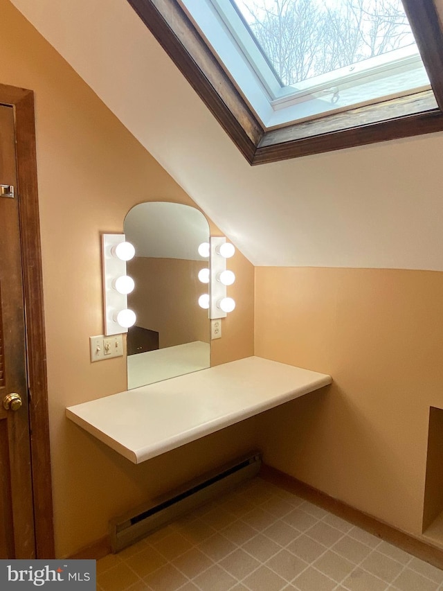 bathroom featuring lofted ceiling and a baseboard radiator