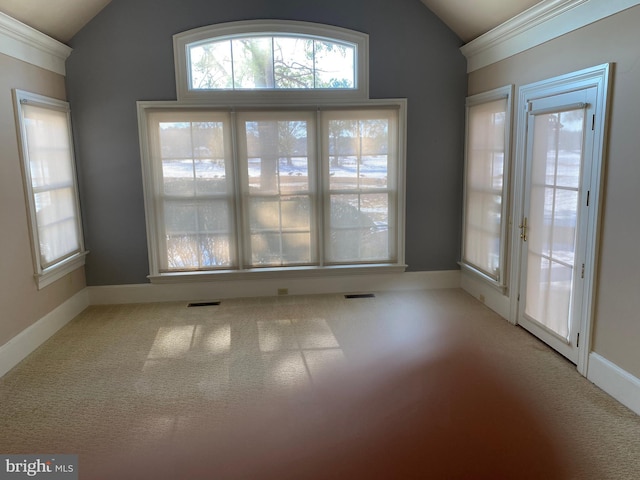 interior space with light colored carpet and vaulted ceiling