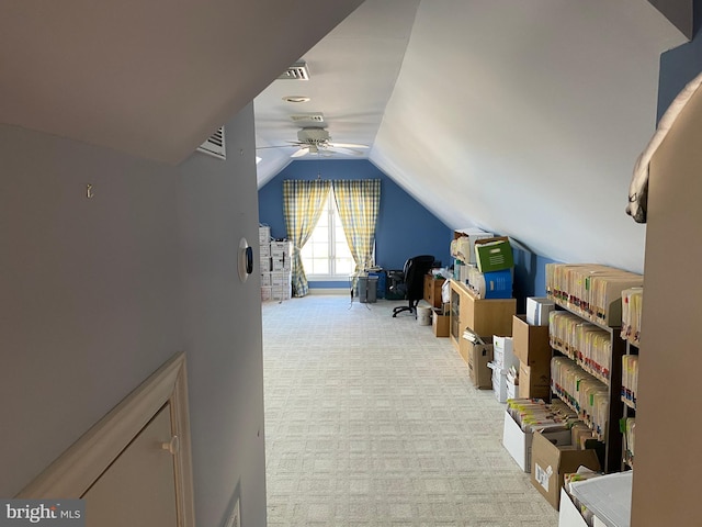 bonus room with ceiling fan, light colored carpet, and vaulted ceiling