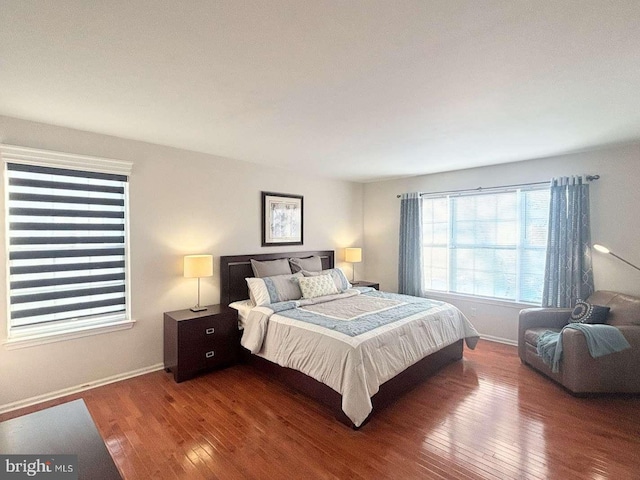 bedroom with hardwood / wood-style flooring