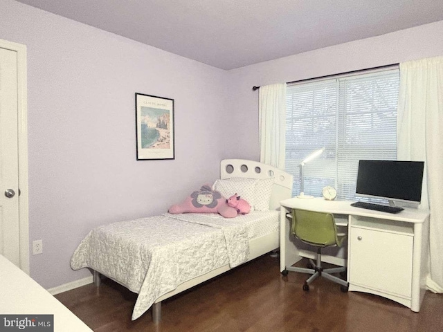 bedroom featuring dark hardwood / wood-style flooring