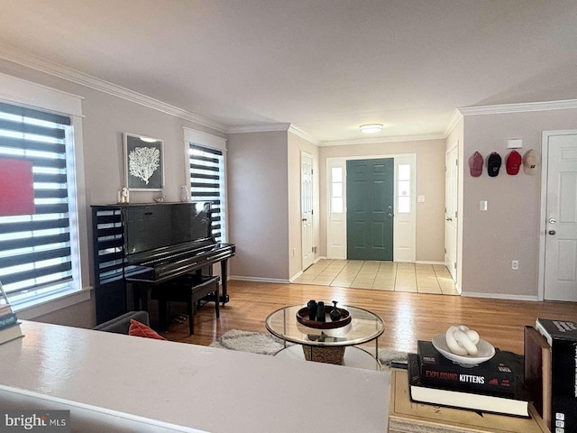 entrance foyer with light hardwood / wood-style floors and ornamental molding