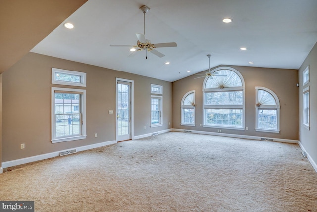 unfurnished living room with ceiling fan, lofted ceiling, and light carpet