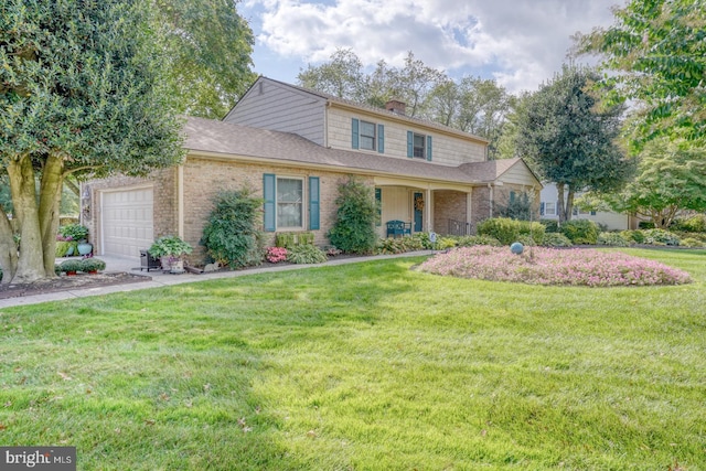 view of front of property with a garage and a front lawn