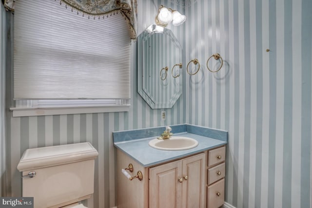 bathroom with vanity and toilet