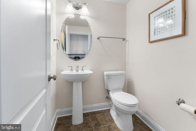 bathroom with toilet and sink