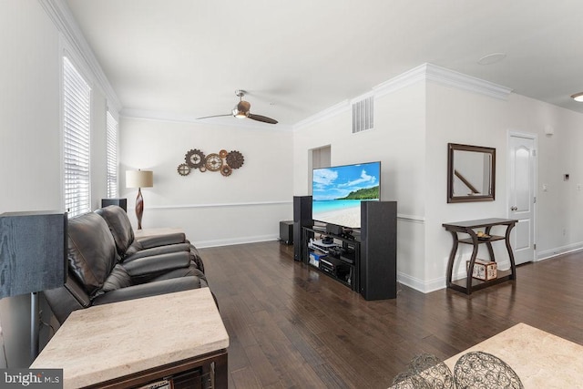 living room with ceiling fan, crown molding, and dark wood-type flooring