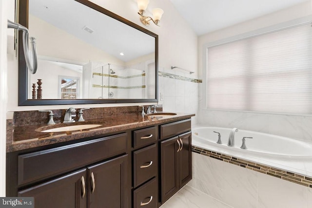 bathroom featuring vanity, lofted ceiling, and shower with separate bathtub