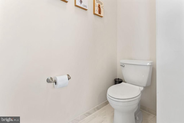 bathroom with tile patterned flooring and toilet