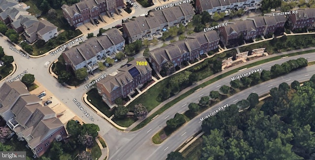 birds eye view of property with a residential view