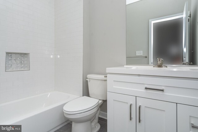 full bathroom featuring vanity, toilet, and tiled shower / bath combo