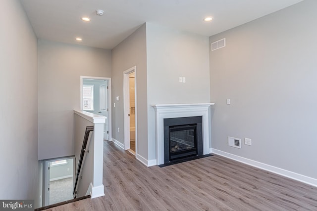 unfurnished living room featuring light hardwood / wood-style flooring