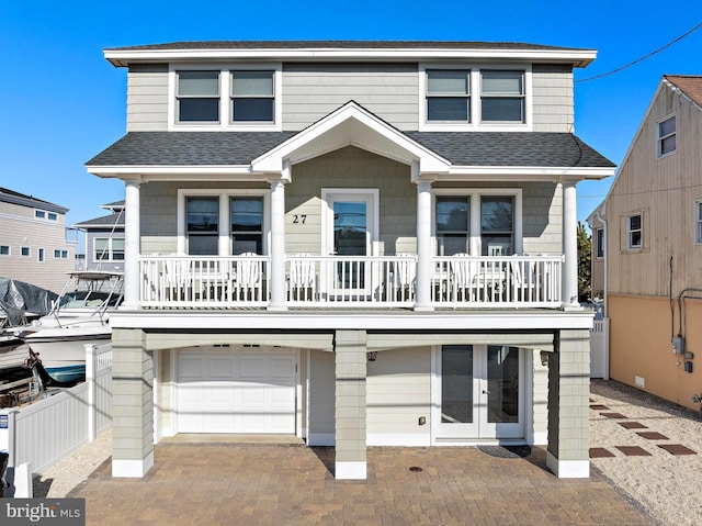 view of front facade featuring a garage and french doors