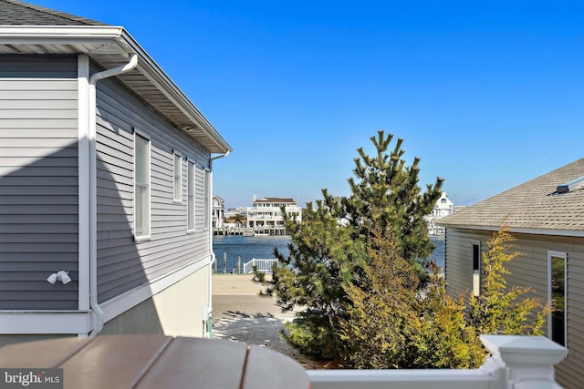 view of side of home featuring a water view