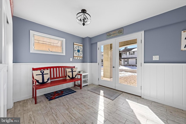 doorway to outside featuring french doors and light hardwood / wood-style floors