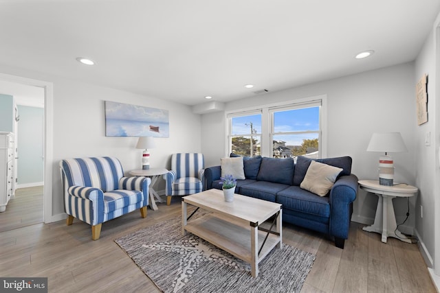 living room with light hardwood / wood-style floors