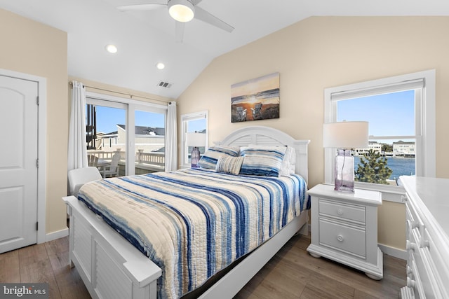 bedroom featuring access to exterior, ceiling fan, dark hardwood / wood-style flooring, vaulted ceiling, and a water view