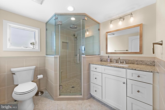 bathroom with vanity, toilet, and walk in shower