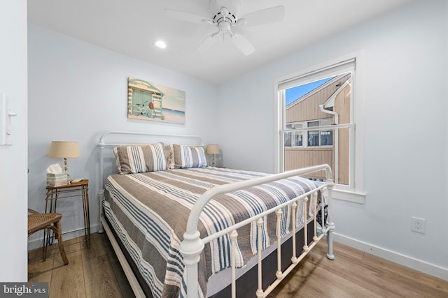 bedroom featuring ceiling fan and hardwood / wood-style floors