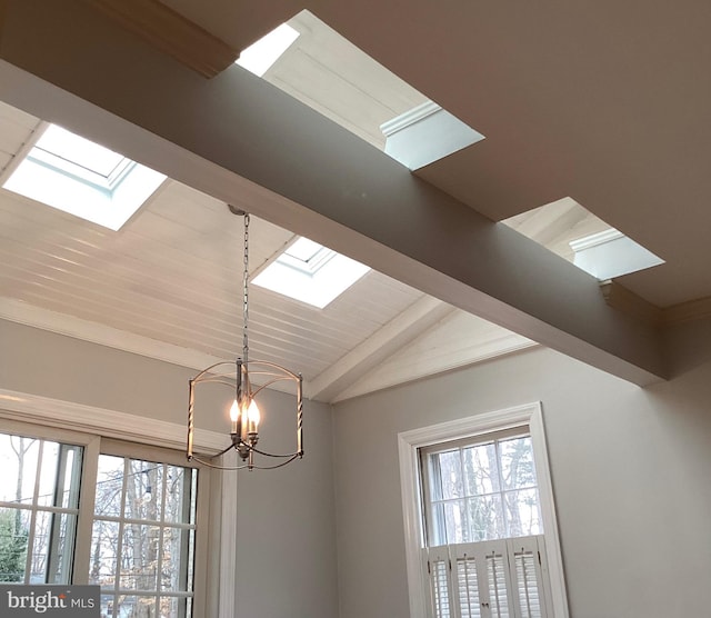 details featuring a skylight and a notable chandelier