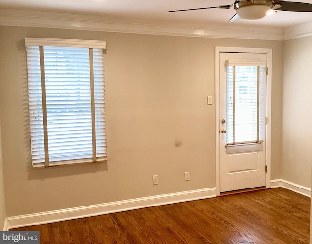 doorway with ceiling fan, ornamental molding, and hardwood / wood-style flooring