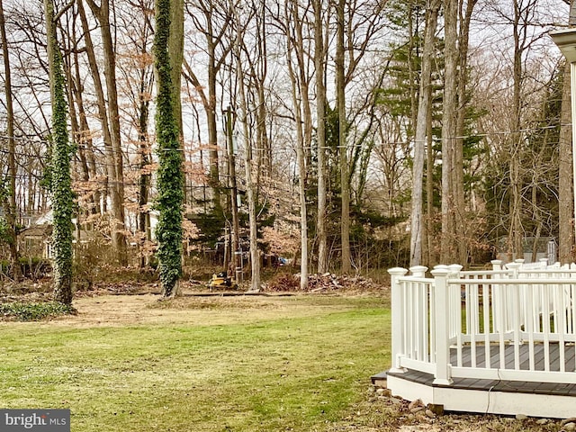 view of yard featuring a wooden deck