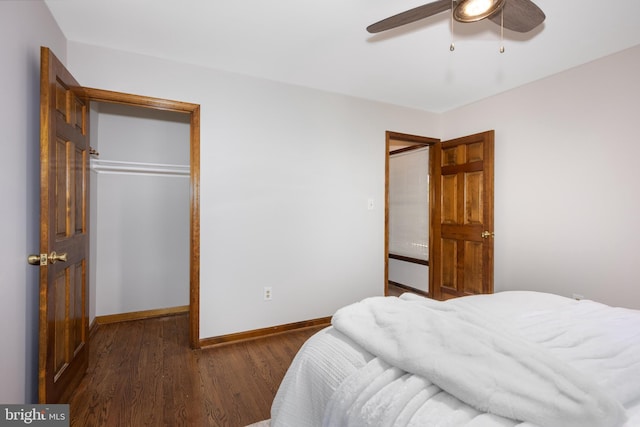 bedroom with wood finished floors, baseboards, a closet, and ceiling fan