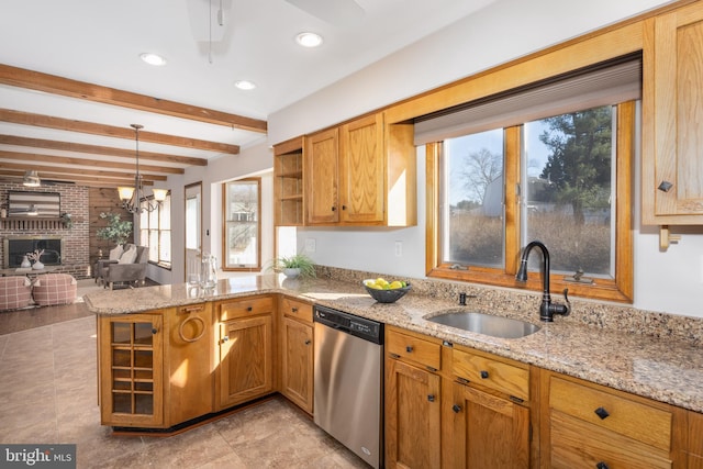 kitchen with light stone counters, dishwasher, a peninsula, and a sink