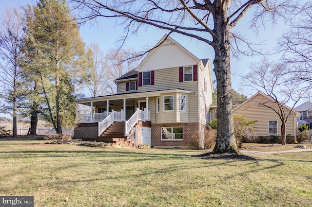 view of front facade with a front lawn, stairway, brick siding, and covered porch