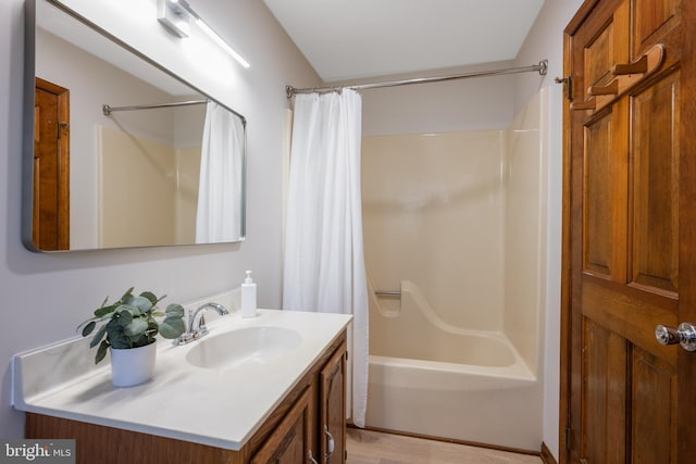 full bath with vanity and shower / tub combo with curtain