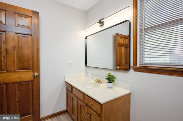 bathroom featuring vanity and baseboards