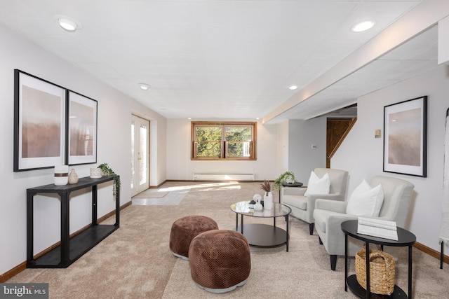 carpeted living room with baseboard heating, recessed lighting, and baseboards