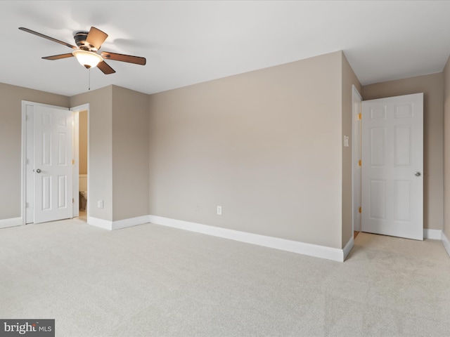 unfurnished room with light carpet and ceiling fan