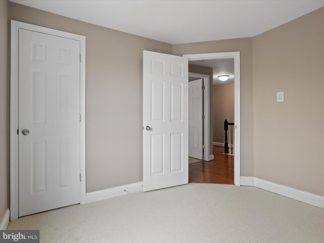 unfurnished bedroom with carpet flooring