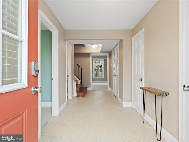 hallway with light tile patterned floors