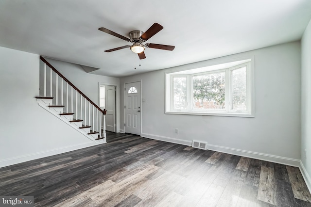 foyer with ceiling fan and dark hardwood / wood-style floors