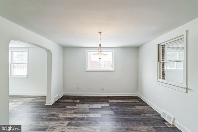 empty room featuring dark hardwood / wood-style flooring