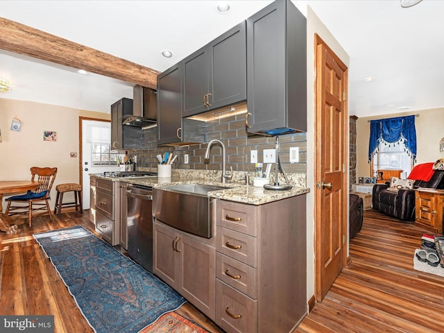 kitchen featuring wall chimney range hood, sink, dark wood-type flooring, beam ceiling, and light stone counters