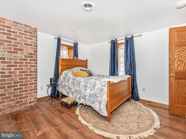 bedroom featuring wood-type flooring