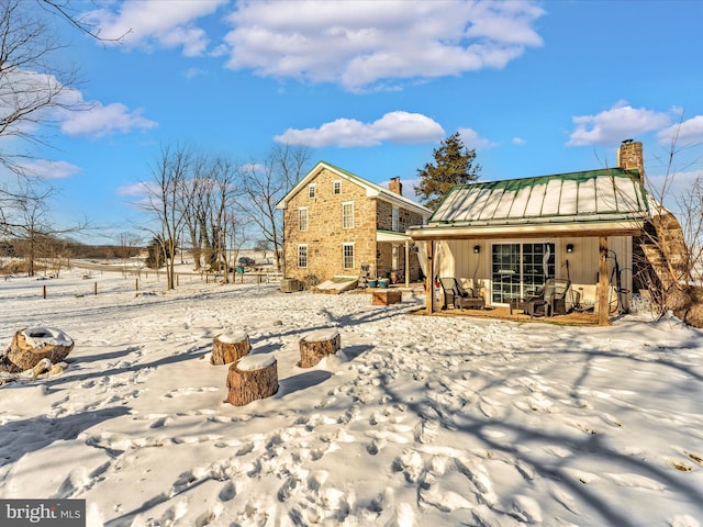 view of snow covered house