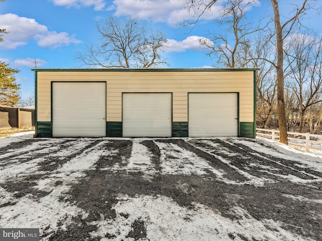 view of snow covered garage