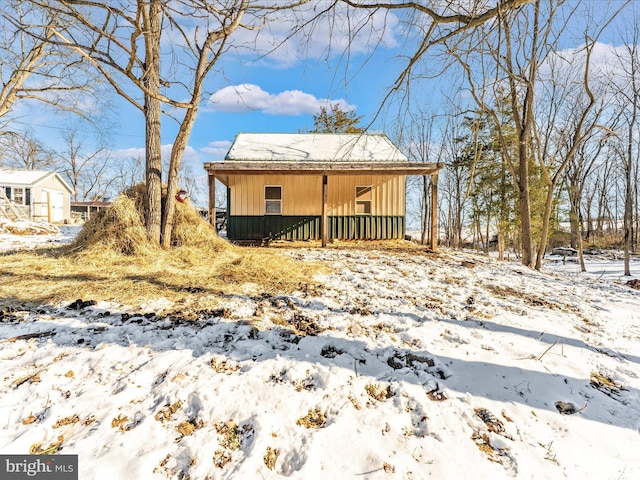 view of snow covered house